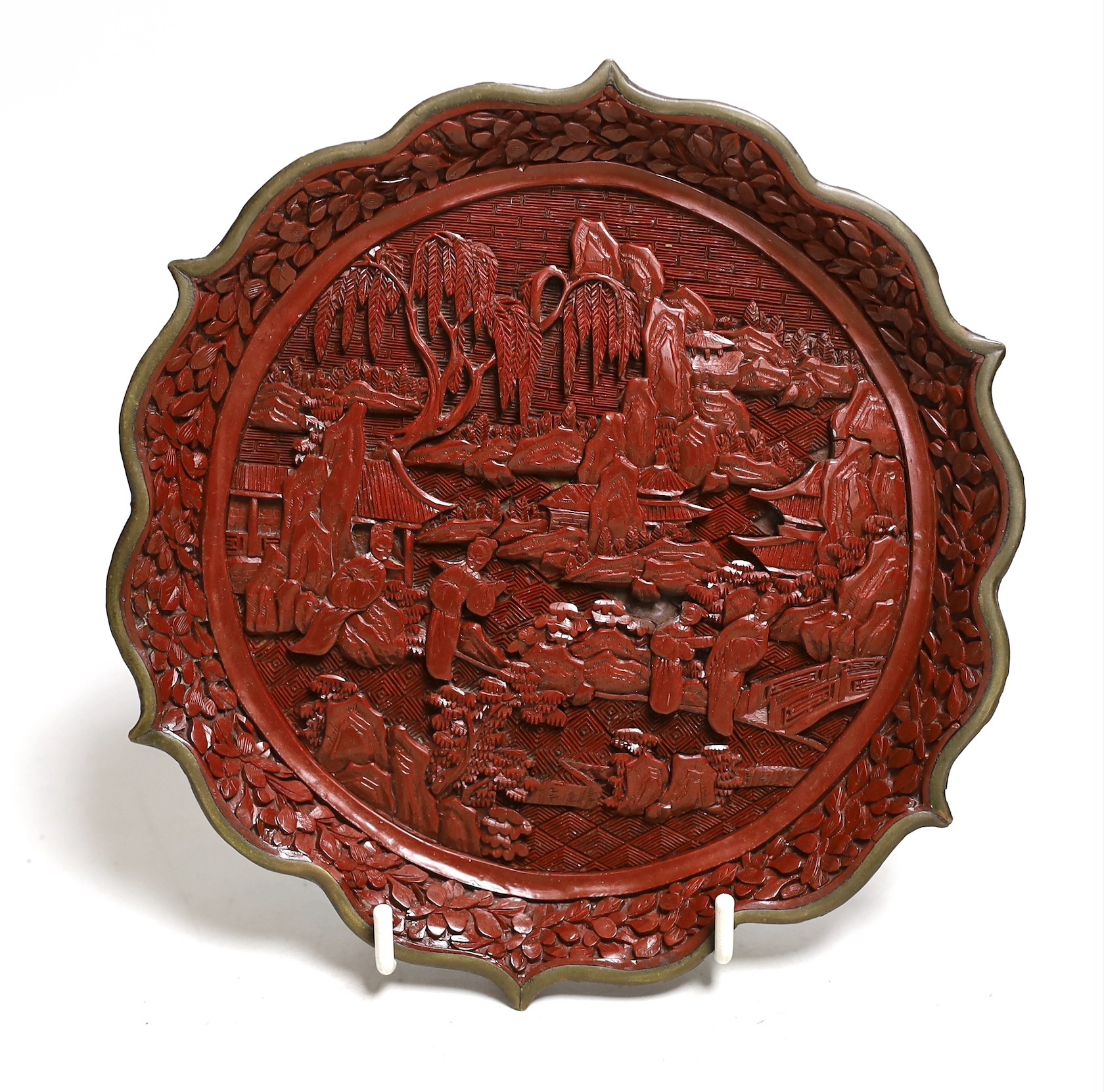 An early 20th century Chinese cinnabar lacquer dish, 29.5cms diameter